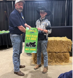 4-H  Youth Member getting an award at the fair
