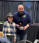 4-H  Youth Member getting an award at the fair
