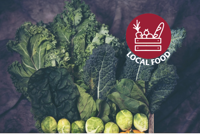 Leafy greens and Brussel sprouts laid out in a fan.