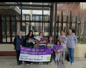 Youth members / volunteers dropping off pillowcases at the Children's Hospital