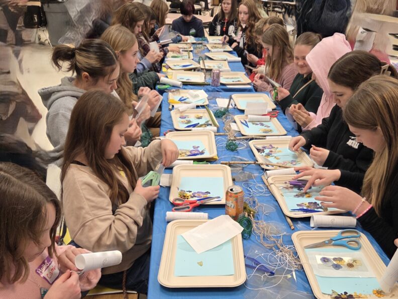 Youth members in a workshop at Super Saturday