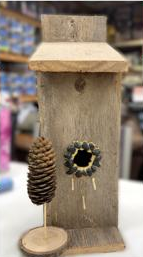 A wood birdhouse 