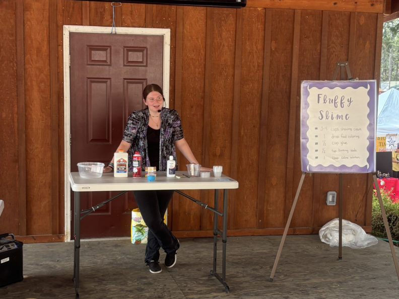Youth member giving public presentation at the county fair.  How to make slime