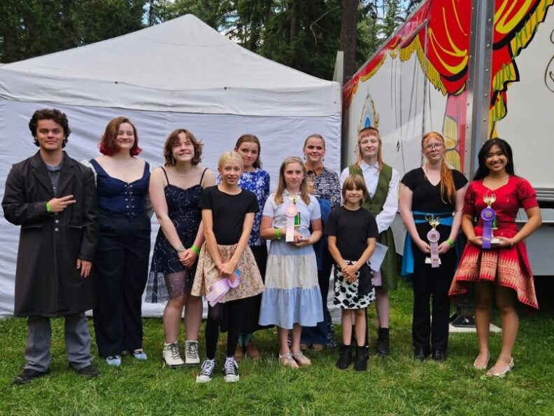Youth at the fair modelling their garments they sewed