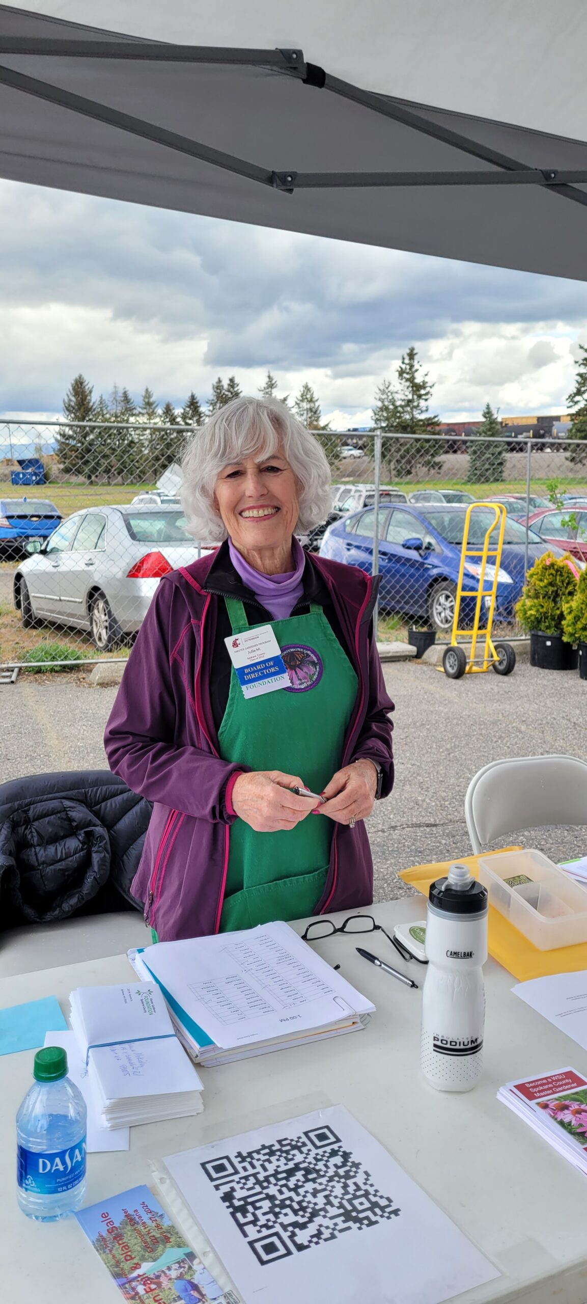 A Spokane County master gardener working at a plant sale.