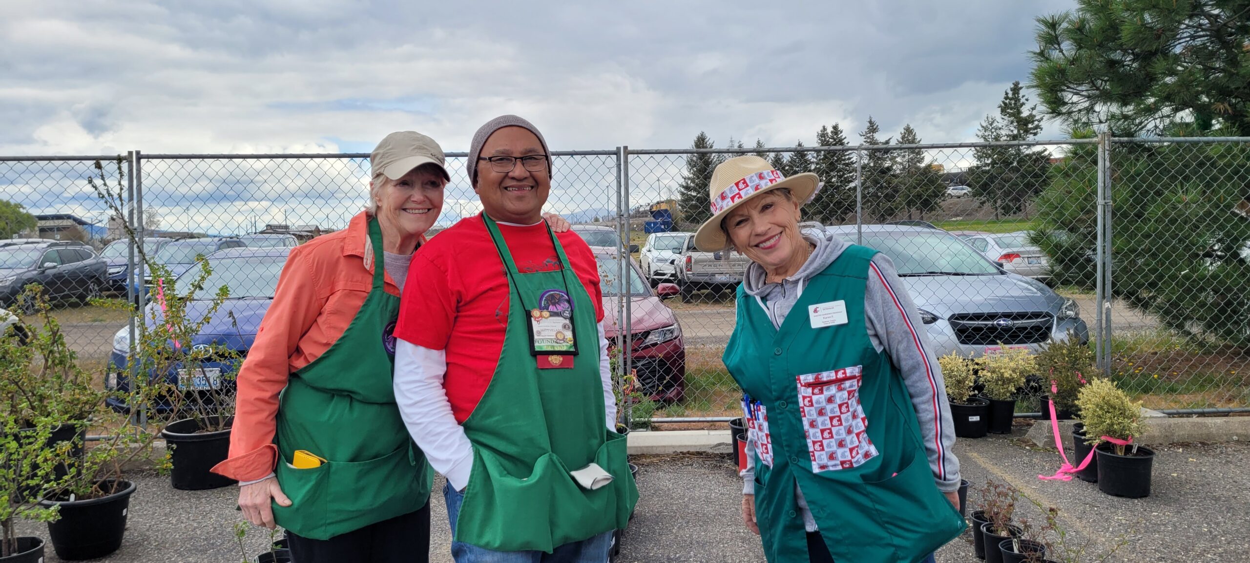 A photo of Spokane County master gardeners working at a plant sale.