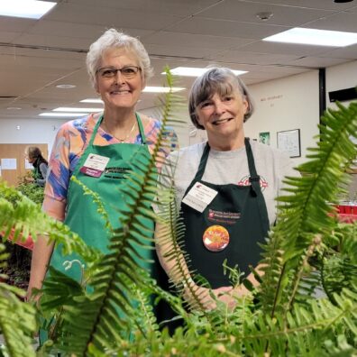 A photo of Spokane County master gardeners working at a plant sale.
