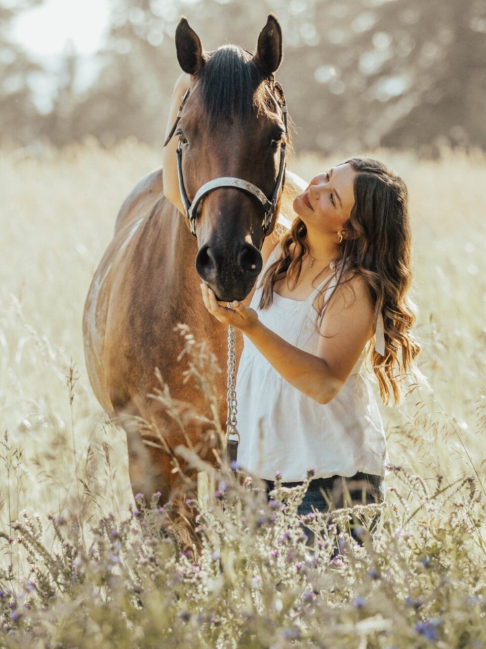 A photo of Heidi Neumiller and her horse.