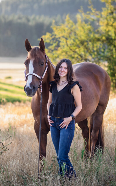 Photo of Lacey Jacobsen with a horse.
