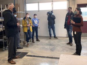 Group of people standing inside a building