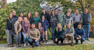 Group of people posing outdoors