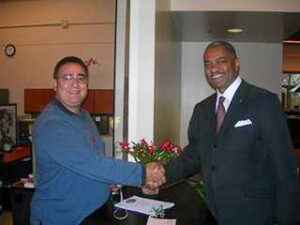 Two men shaking hands.