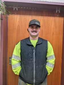Young man in reflective jacket.