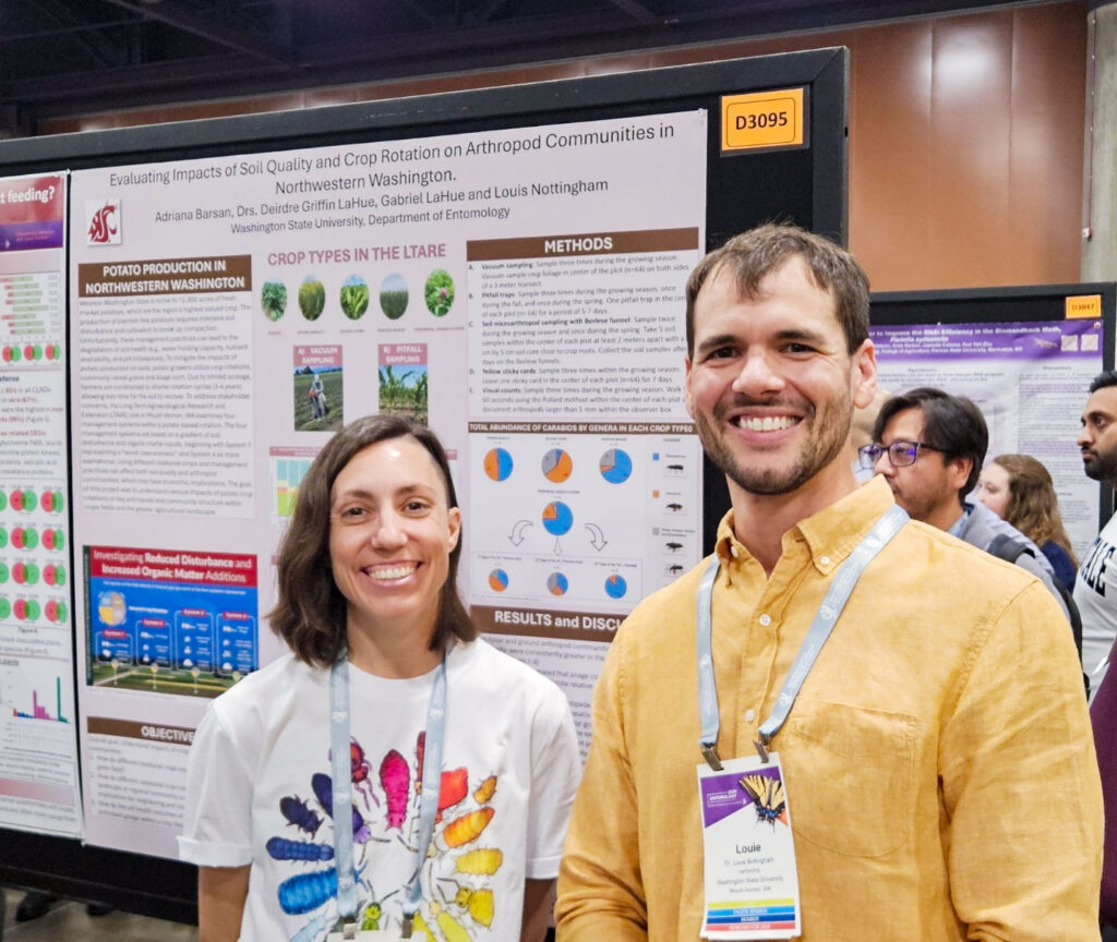 Two people standing in front of a tan poster presenting research methods and results.
