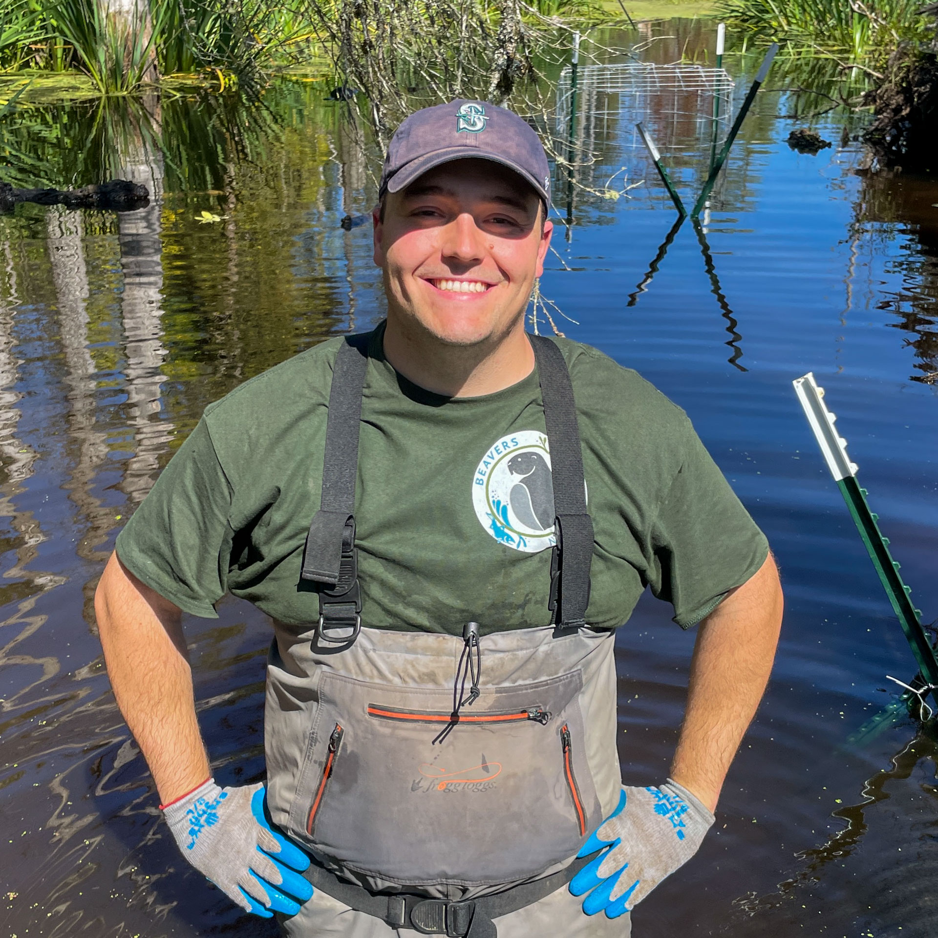 Joe Mouser wearing waders and standing in water.