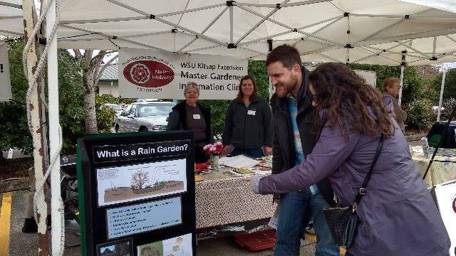 Man checking out at a Master Gardener event