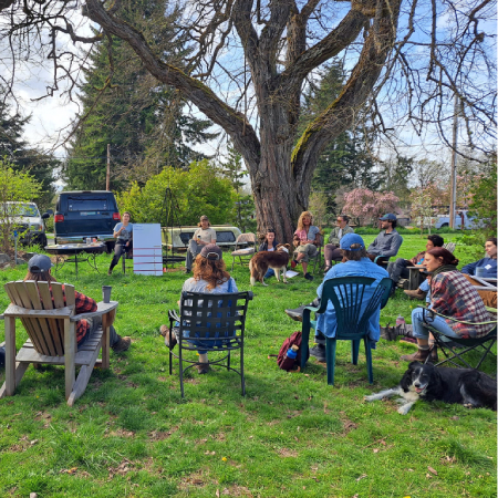 Farmers outside under a tree