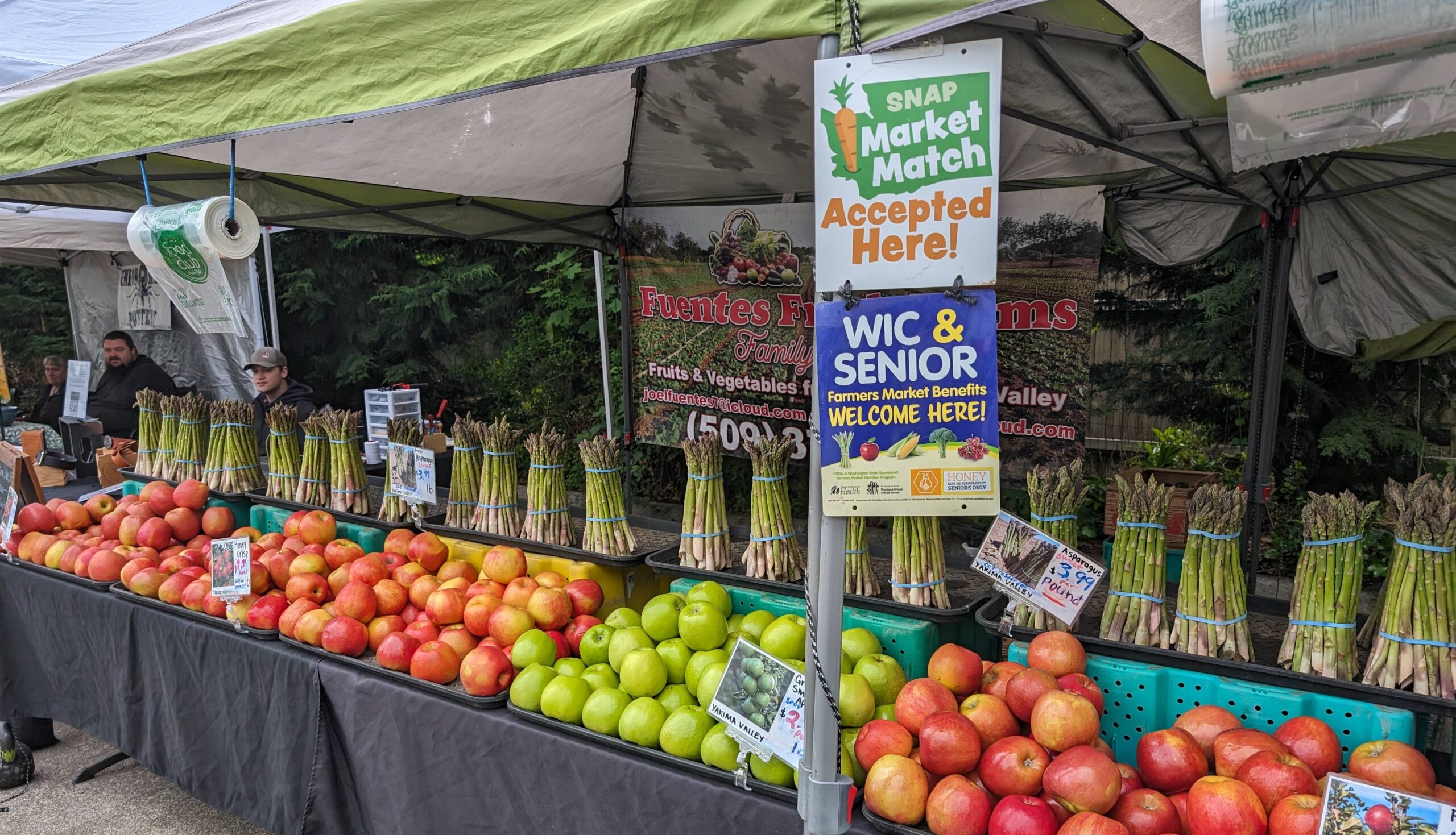 Fruit stand with various fruits.