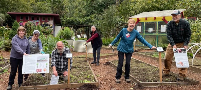 Master Gardeners at demonstration garden in raised beds
