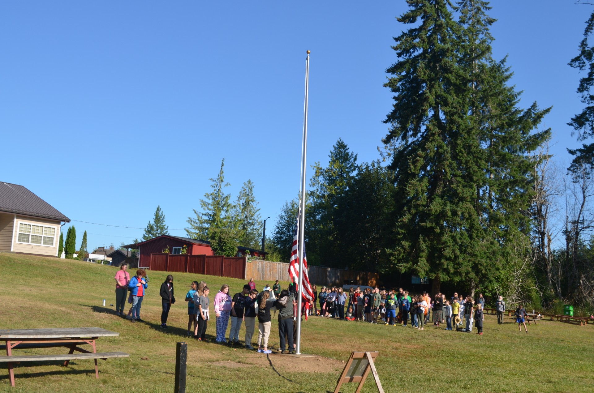 4H campers raising the flag
