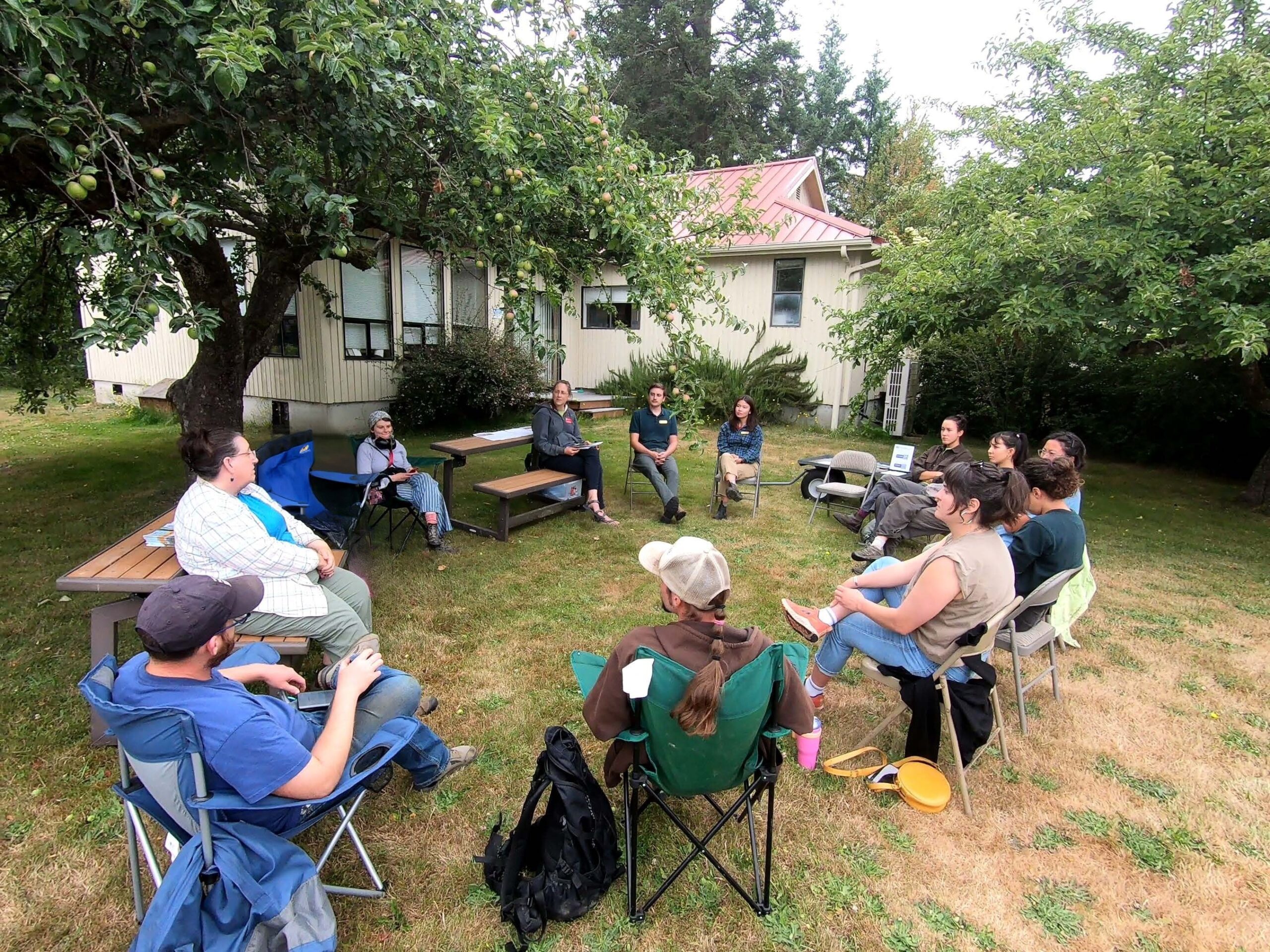 IPM Class, farm mentors and speakers sitting in a circle. 