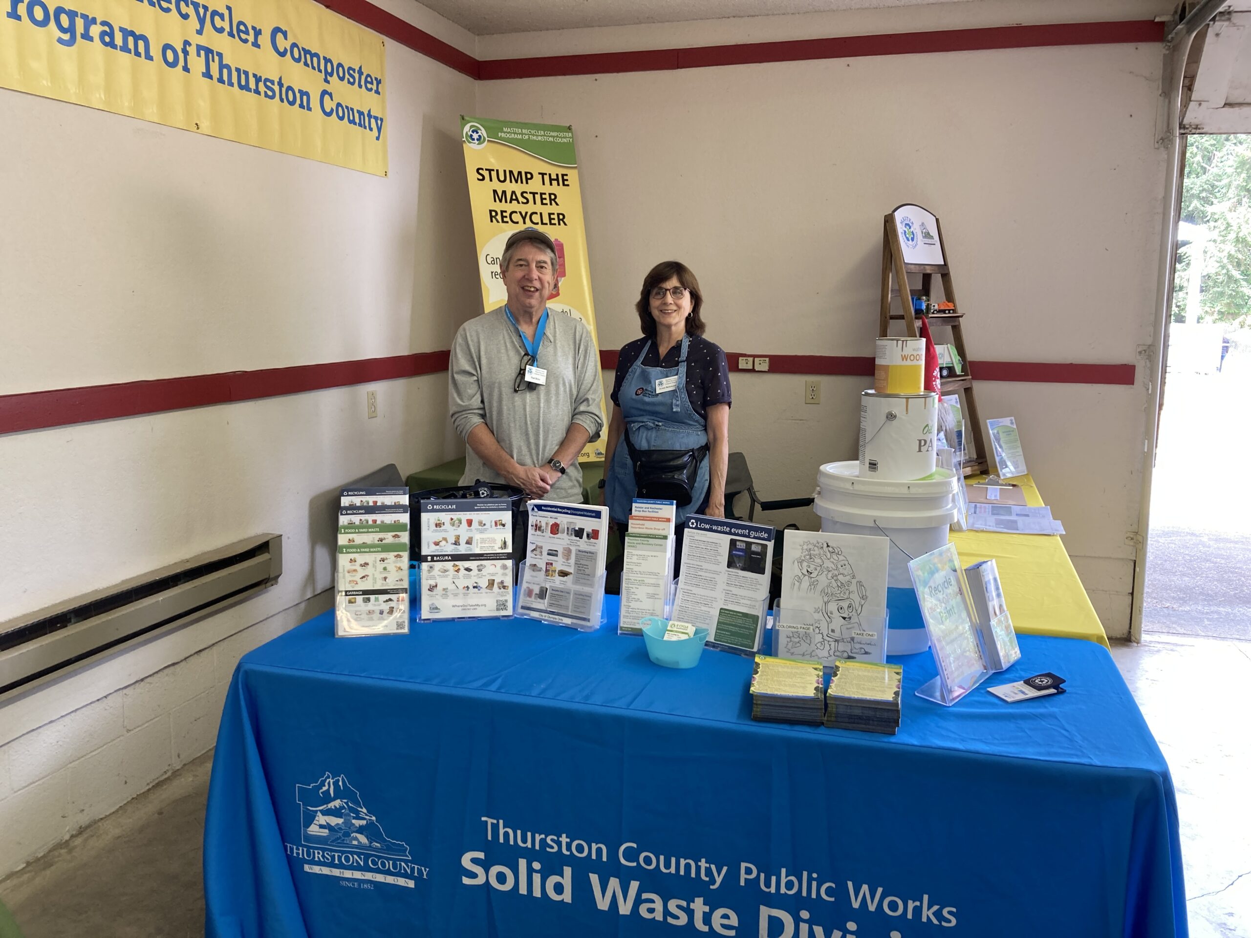 MRC volunteers at a booth with resources at the fair