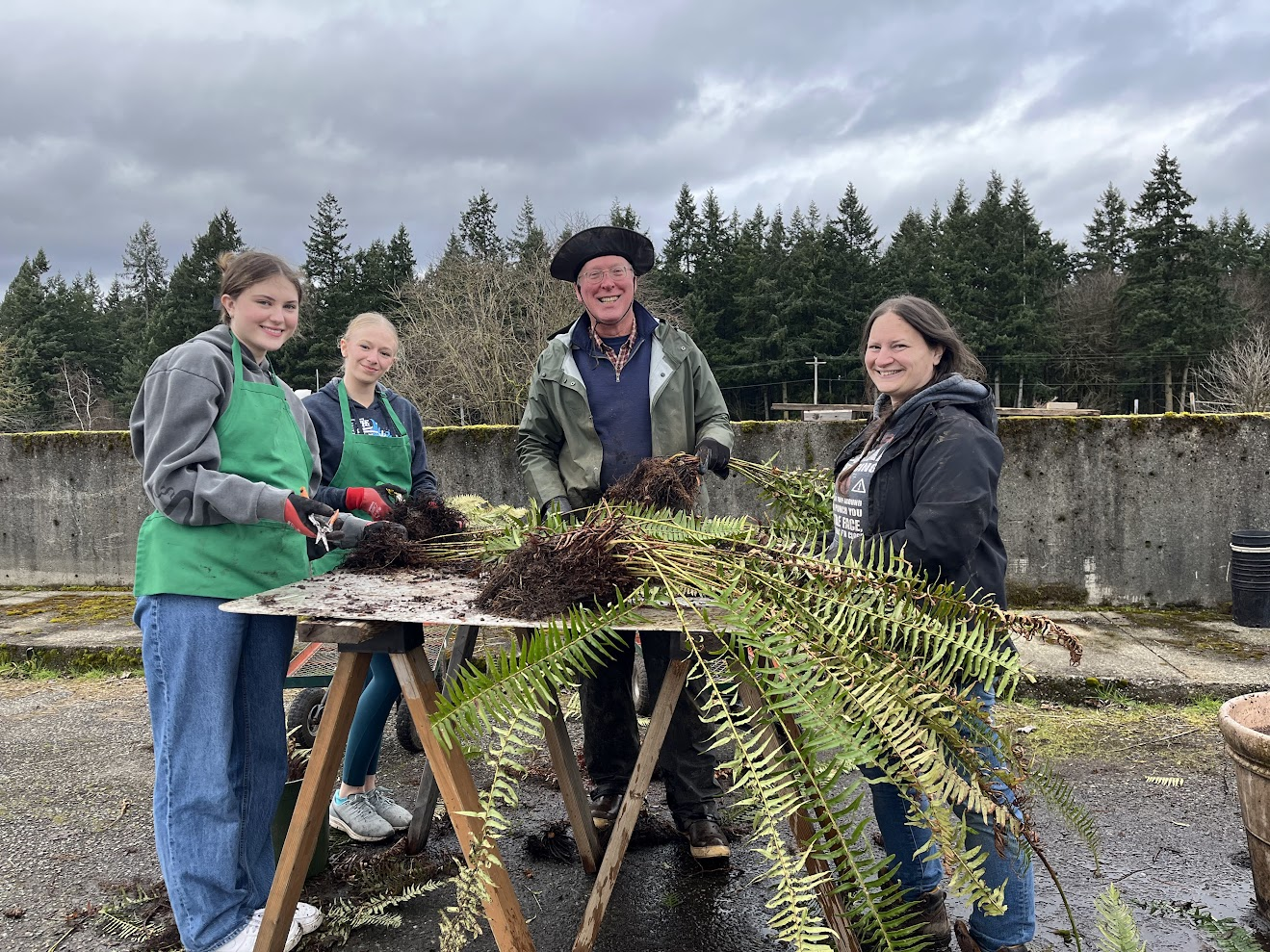 After digging native plants in the morning, volunteers spend the afternoon at the WSU/NPSF nursery potting the plants for use in future water- and habitat-protection projects.