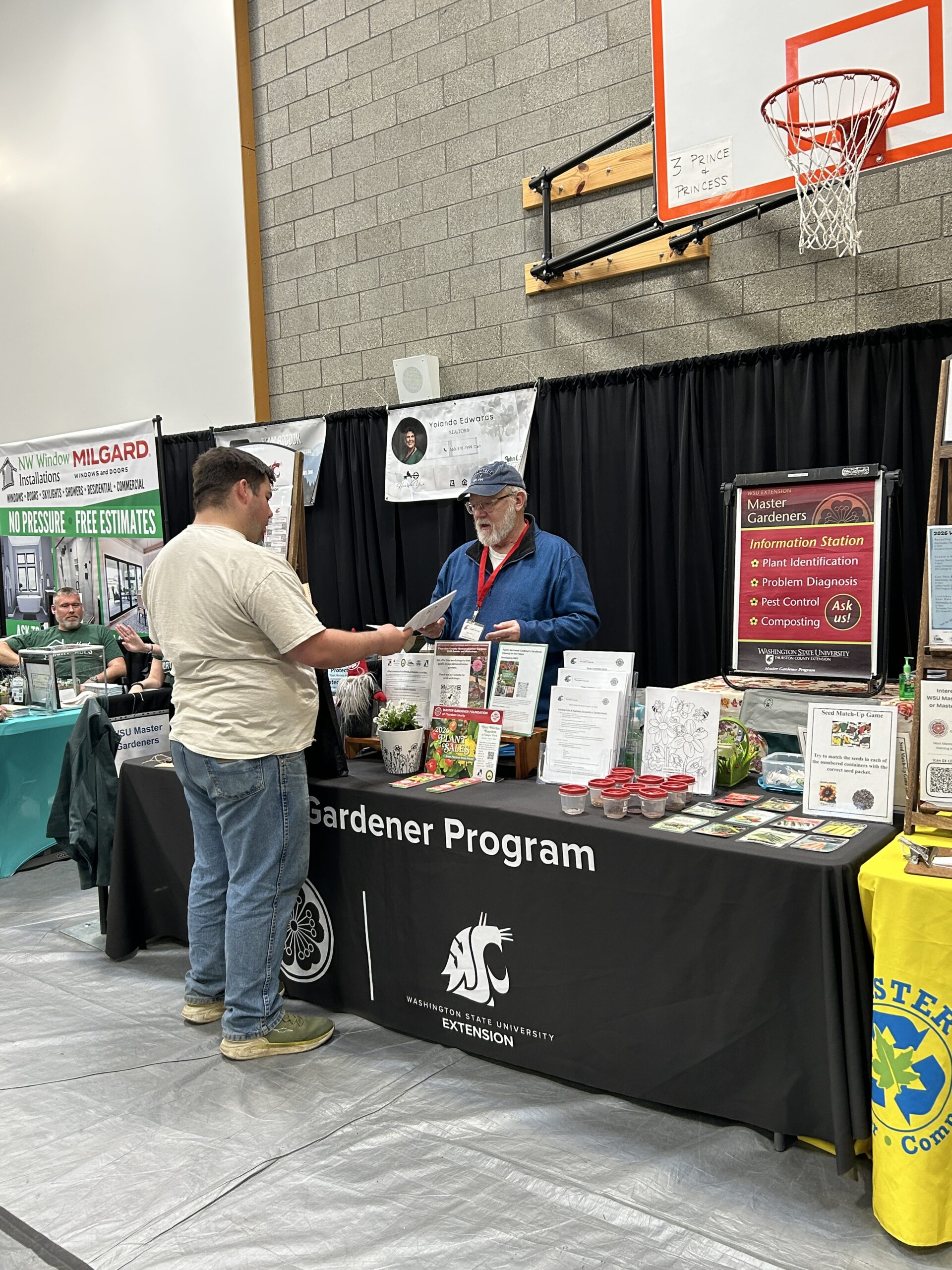 WSU Master Gardener volunteer answering questions at an in-person question and answer clinic. 
