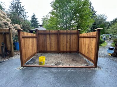 New fence surrounding a two unit compost staging area.