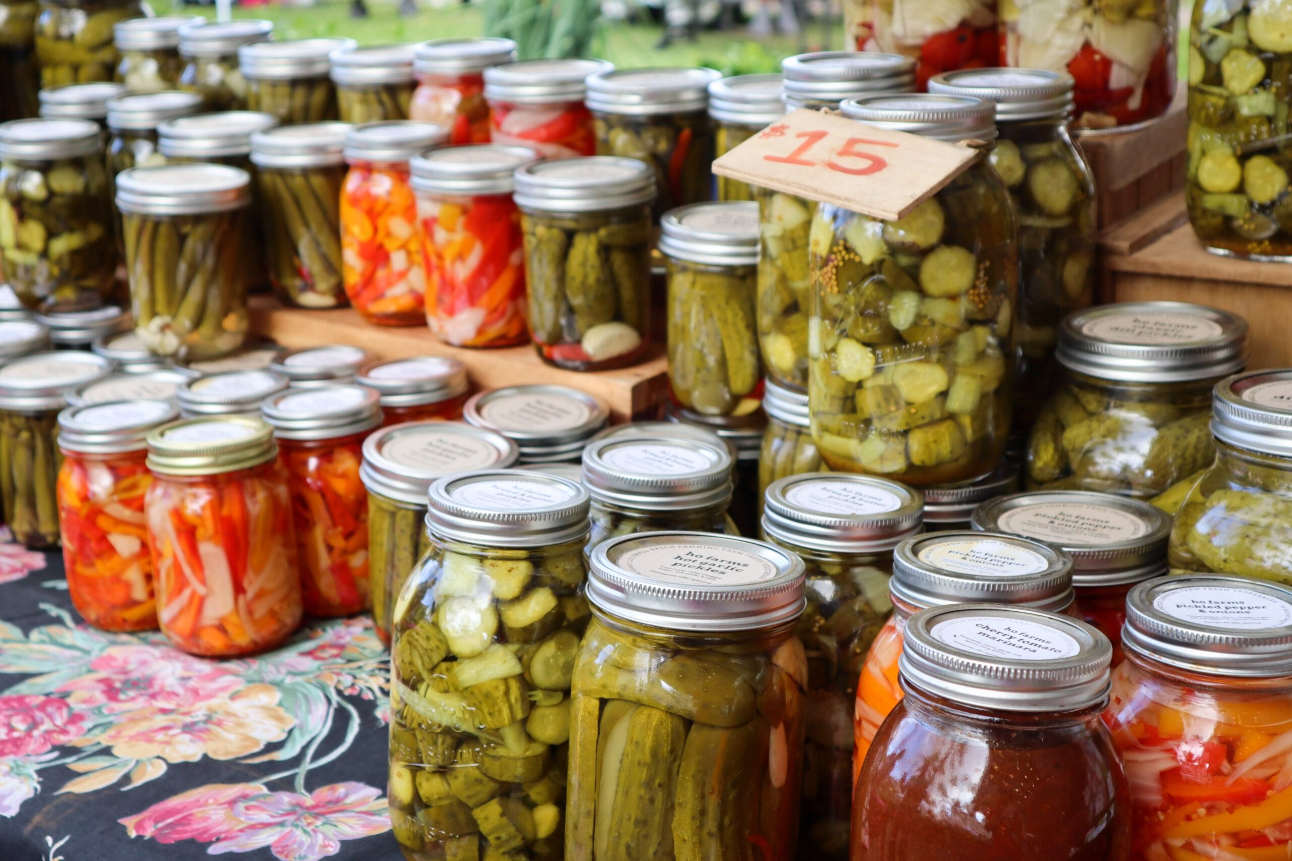 jars of preserved vegetable on a table for sale