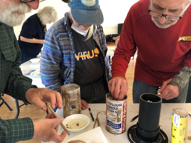 People working hands on at a mason bee workshop