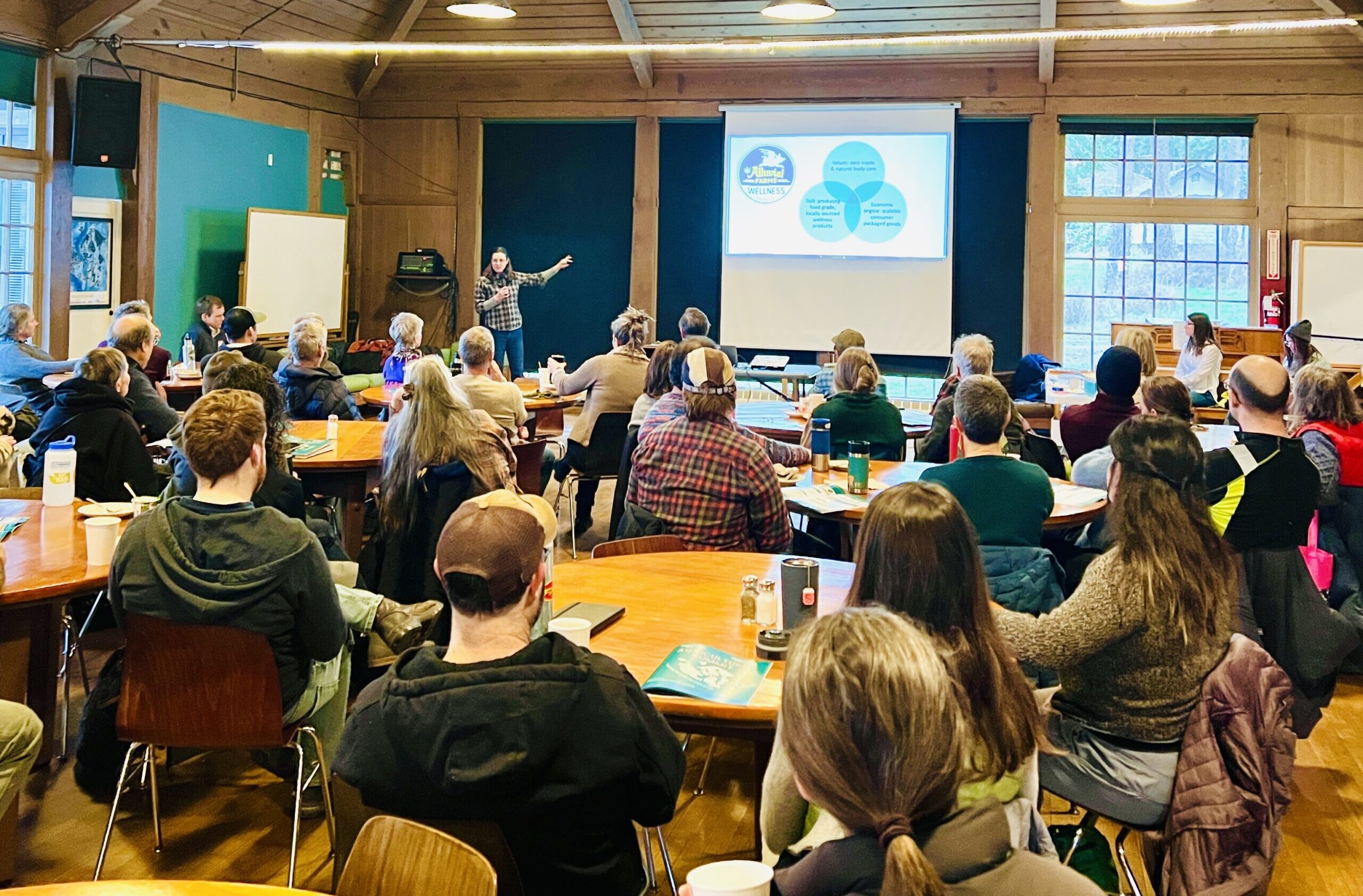 People attending an Agricultural Summit presentation