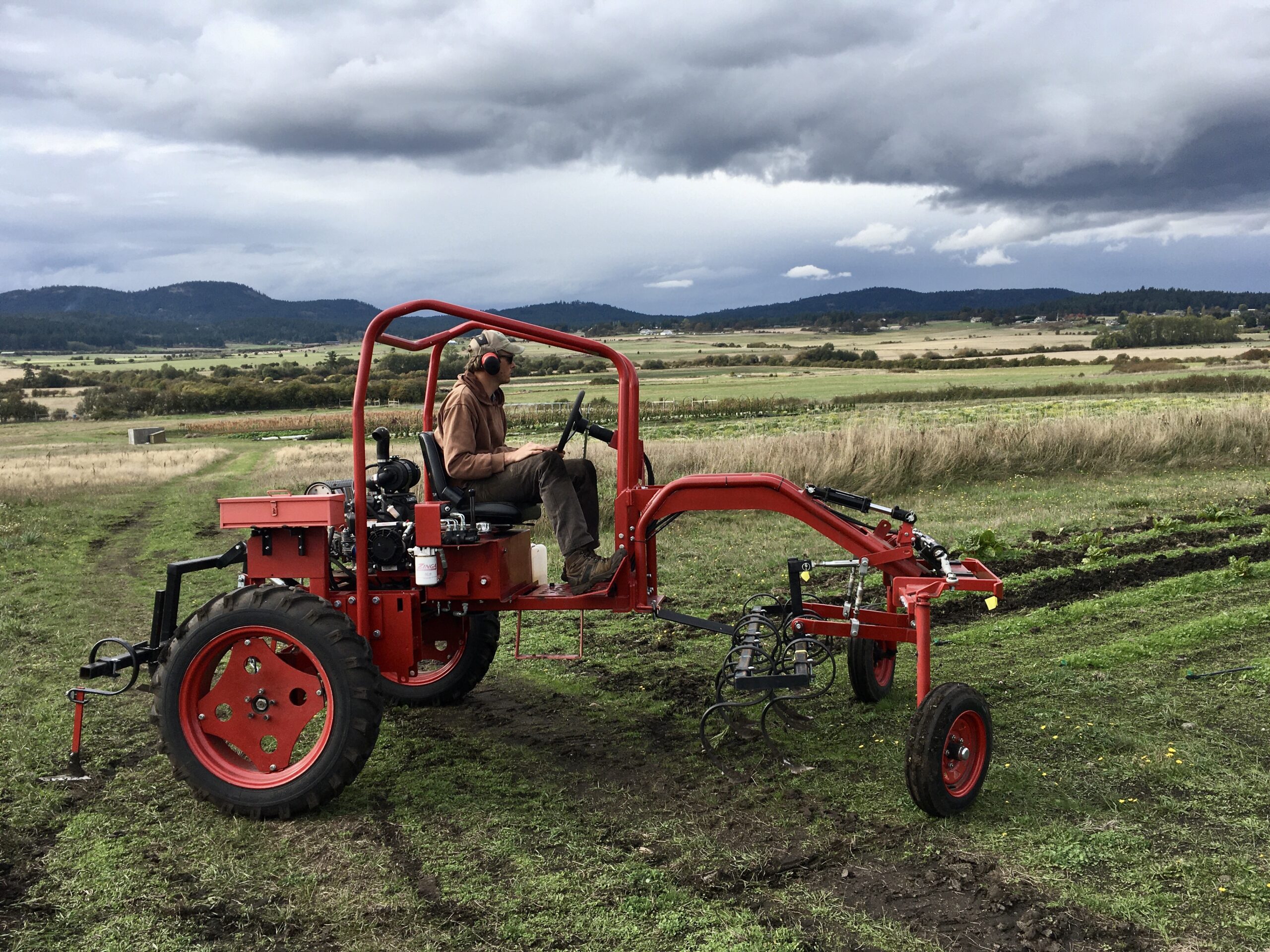 San Juan County farmer operating tractor equipment