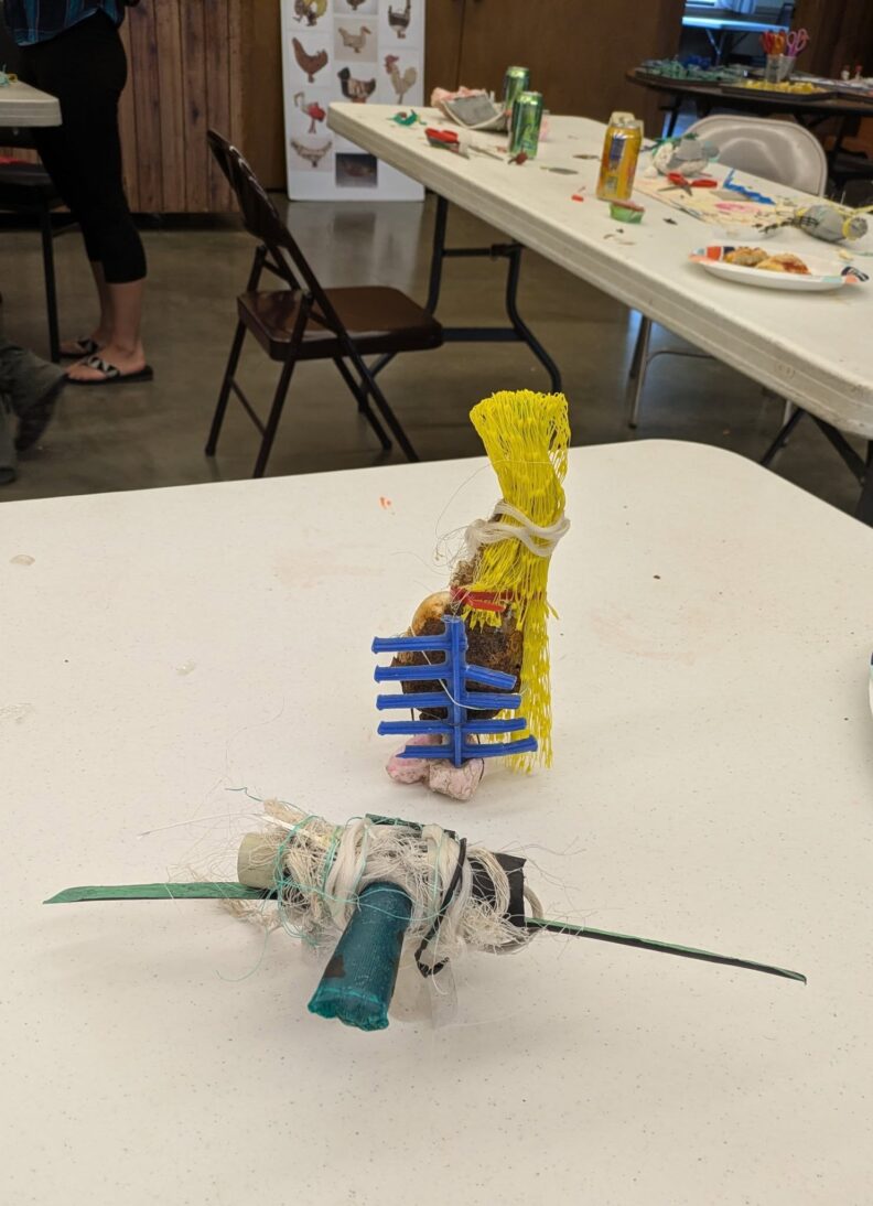 Creative art work created by a five-year-old participant described as being a bird and tree house made from beach trash. 