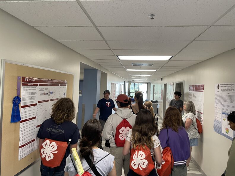 A group of youth learning about extrusion in the Food Science Department. 