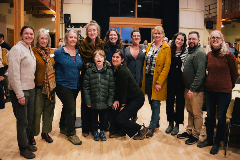 2025 Ag Summit Steering Committee Group Photo featuring Rebecca Moore, Kristen Arnim, Faith Van De Putte, Sara Jones, Jaime Beechum, Pauline Chiquet, Caitlin Leck and son, Lauren Bigelow, Peggy Bill, Breton Carter, Kellen Moody