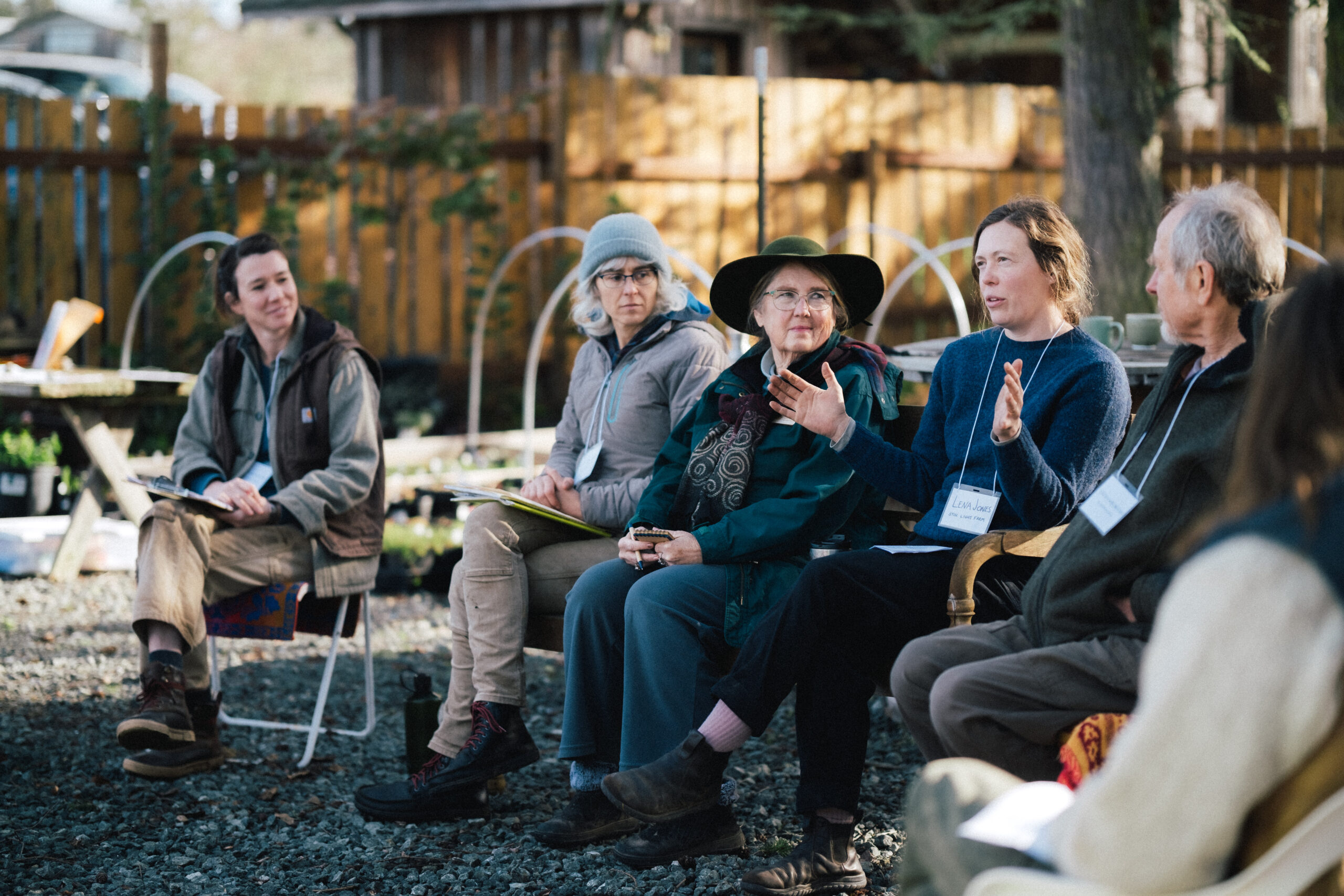 Image of farmers sitting outside, presenting at a nursery workshop at the 2025 Ag Summit