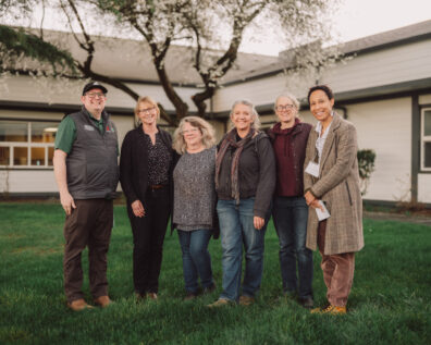 Image shows WSU Extension staff and Ag Summit steering committee standing outside the Friday Harbor High School following the 2026 Ag Summit.