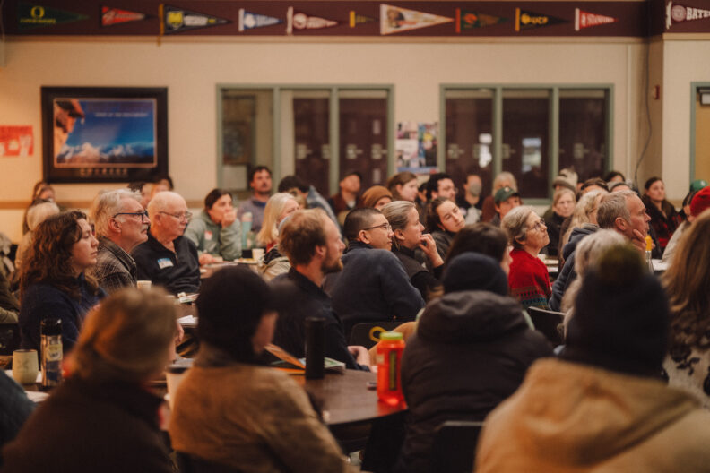 Image of audience in the Friday Habor High School cafeteria, listening to the keynote speaker at the 2026 Ag Summit 