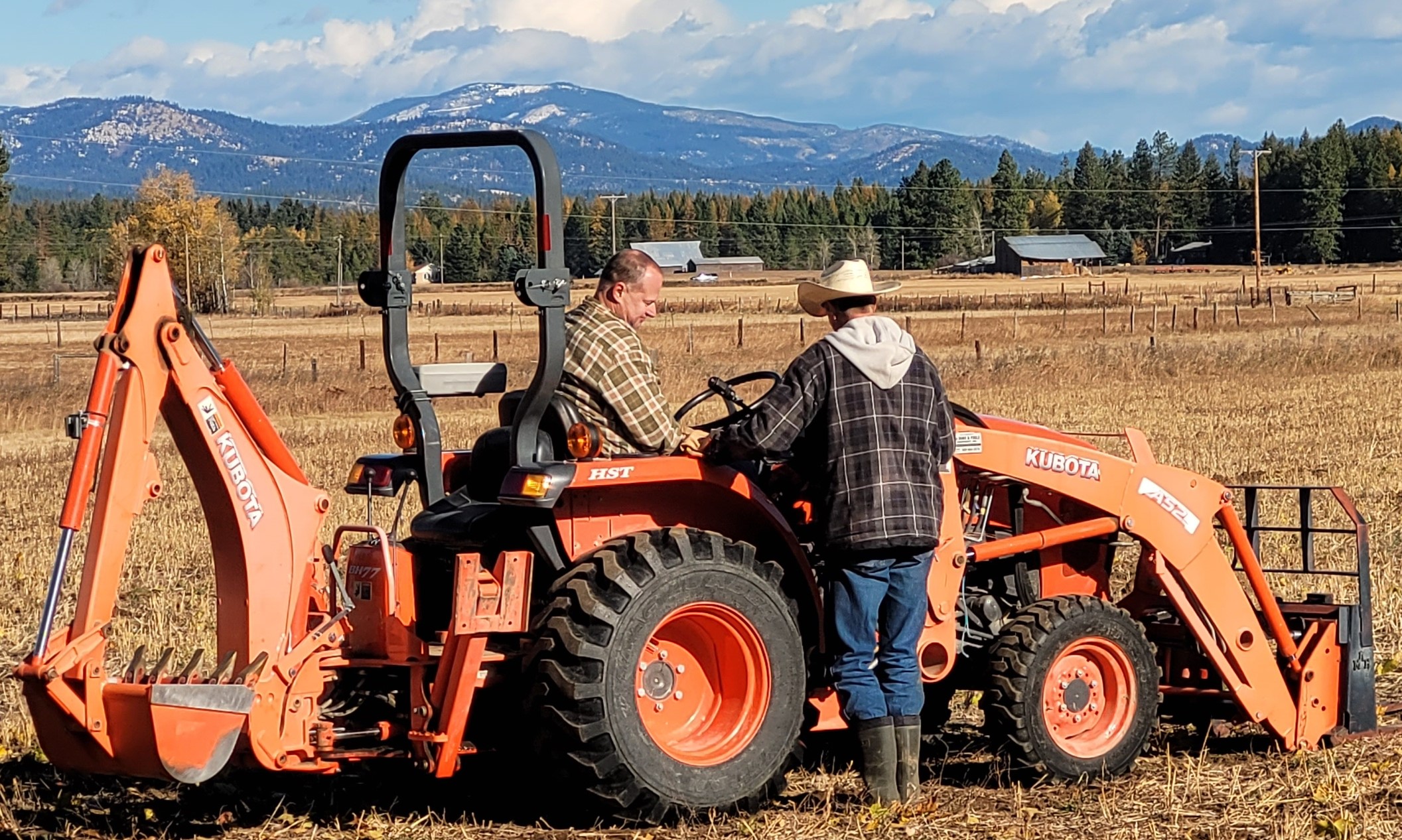 Picture of tractor with student and teacher.