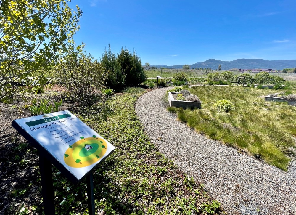 Sign and pathway through the old Firewise Demonstration Garden in Colville, WA.