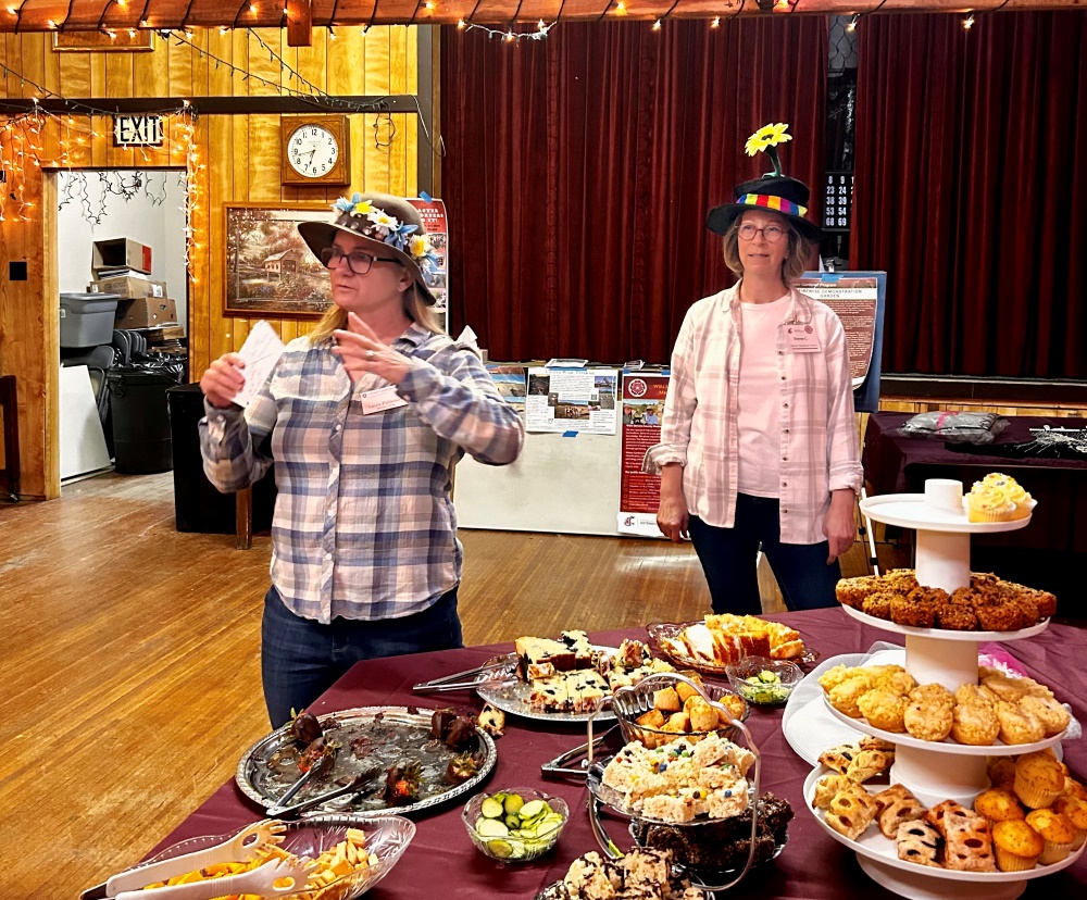 Two Master Gardeners speaking at the Springdale Mad Hatters Tea Party