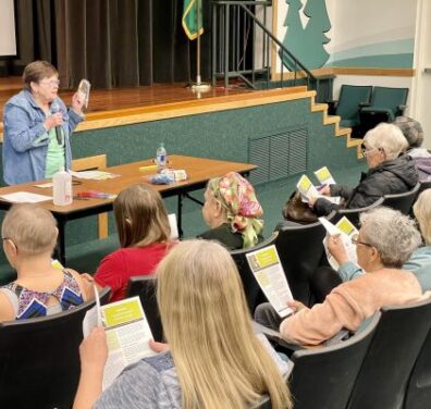 Master Gardener Lavera Wade Teaching how to Grow Tomatoes to an audience in the SCC Auditorium.