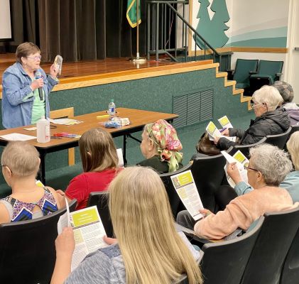 Master Gardener Lavera Wade Teaching how to Grow Tomatoes to an audience in the SCC Auditorium.