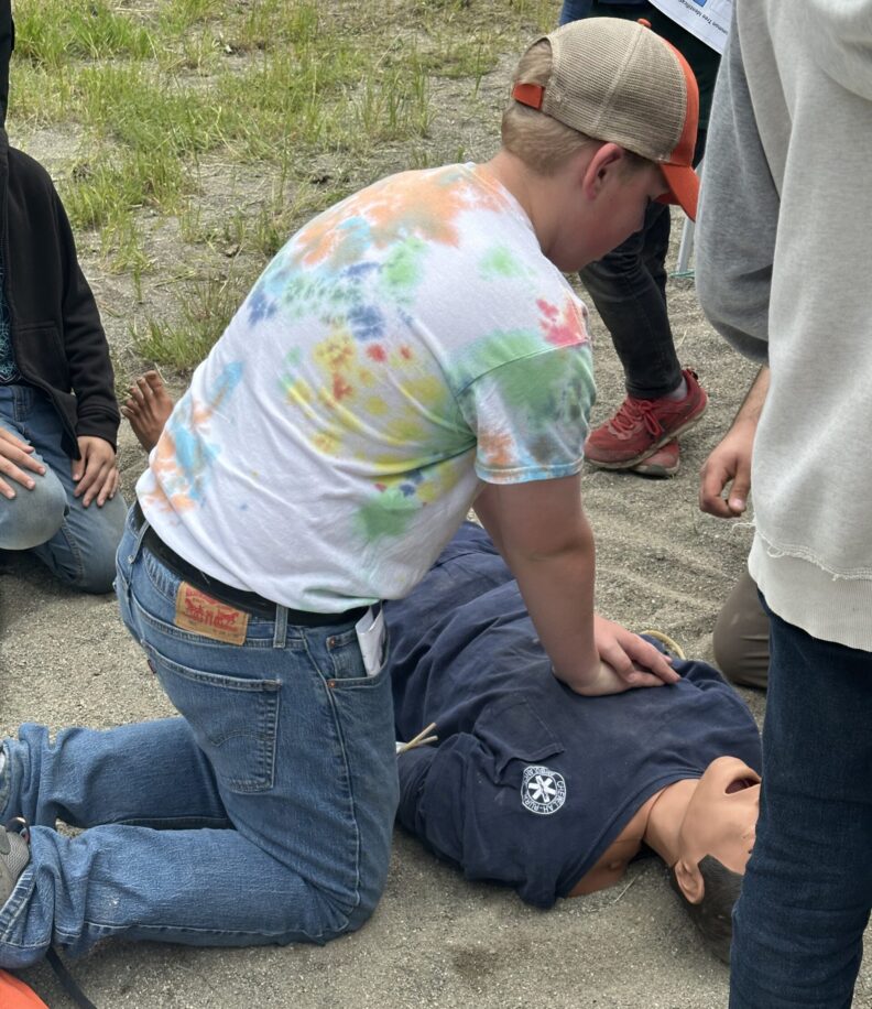 4-H Youth learning CPR
