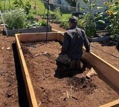 Barry building a new raised bed at the Colville Food Bank Garden