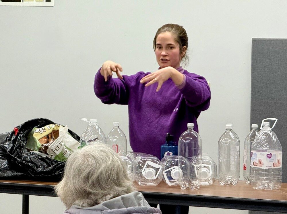 Master Gardener Elisabeth teaching a library class about Milk Jug Greenhouses.