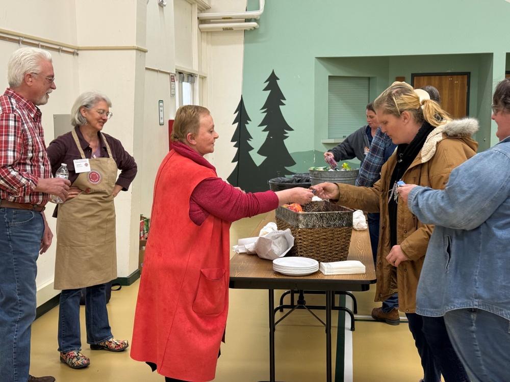 Master Gardener Kathy works the lunch line with MG Intern Lynn looking on - midway through the "From the Ground Up" gardening workshop.