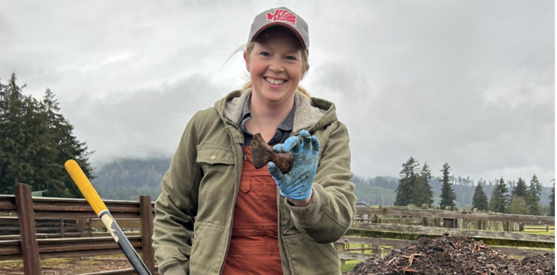 Rachel Wieme pulls a bone from an offal compost pile that was set up 12 days prior during a demonstration at Riverbend Ranch.  Photo credit: Sarah Lemon (WSDA)