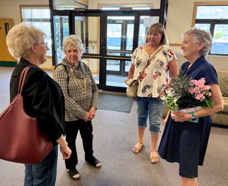4 women standing in a lobby: from Left to Right, Washington Senator Shelly Short, WSU Extension Director for Chelan/Douglas County Margaret Viebrock, WSU Extension Director for Colville Reservation Linda McLean, and Debra Hansen.